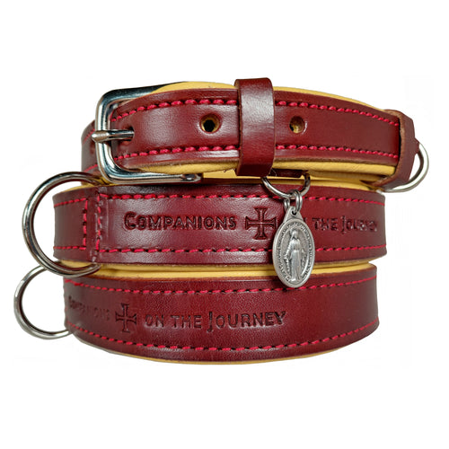 Handmade chestnut leather dog collar with red stitching  and nickel plated buckles with a Miraculous Medal of the Blessed Virgin. Leatherstamp says Companions on the Journey