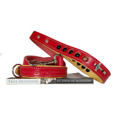 Load image into Gallery viewer, Red leather dog leash with deer skin tanned liner with rosary beads in handle and crucifix, sitting ontop of book True Devotion by St. Louis de Montfort